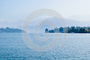 Quatre cantons lake and swiss mountains with mist photo