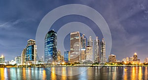 Panorama,Modern buildings and business district cityscape from urban park,night view,cityscape image of Benchakitti Park,Bangkok,
