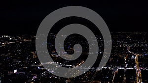 Panorama of modern dark city at night. Stock footage. Top view of beautiful modern city with glowing skyscrapers on dark