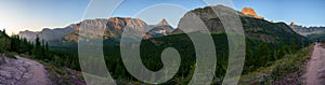 Panorama Of Morning Light Hitting Grinnell Point and Swiftcurrent photo