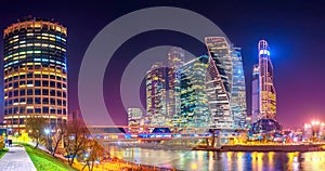 Panorama of Moscow City with reflections in Moscow river at night.