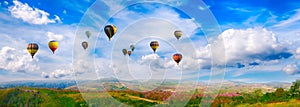 Panorama of mountain with hot air balloons on morning at Thailand.