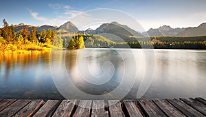 Panorama of Mountain lake Strbske pleso in National Park High Tatra, Slovakia, Europe at sunrise