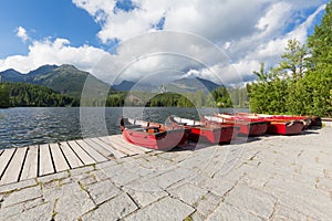 View of the Panorama mountain lake Strbske Pleso in the Tatra mountains. Summers colors and boat for swimming