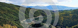 Panorama of mountain landscape with small lake