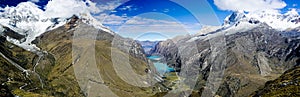 Panorama mountain landscape with snow-capped mountains and valley with turquoise mountain lakes