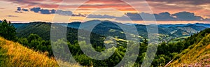 Panorama of mountain ridge with peak at sunset