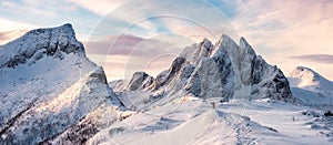 Panorama of Mountaineer standing on top of snowy mountain range