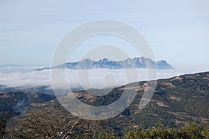 Panorama of the mountains and forests of El Valles in Catalonia photographed from the mount of La Mola. View of Montserrat.