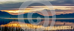 Panorama of the mountains and lake at sunrise