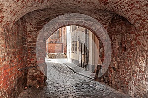 Panorama of a narrow street in Riga, a pedestrian cobblestone street of Vecriga Vecpilseta, the historical center old town of