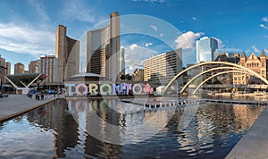 Panorama of Nathan Phillips Square and Toronto City Hall at sunset