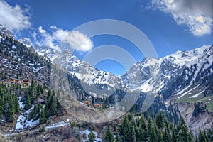 Panorama of nature fir and green mountains, snow and sky in Chimbulak Almaty, Kazakhstan