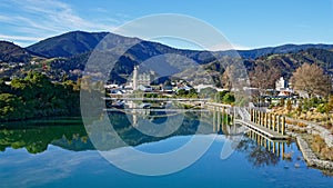 Panorama of Nelson City, reflected in the Maitai River, New Zealand photo