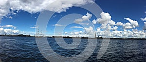 Panorama of the Neva river with the sailing ship Poltava, warships and Petro-Pavlovskaya fortress. Preparation for the naval