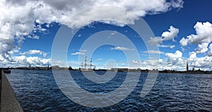 Panorama of the Neva river with the sailing ship Poltava, warships and Petro-Pavlovskaya fortress. Preparation for the naval