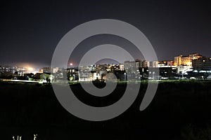 Panorama notturno di Benevento con luna sorgente photo