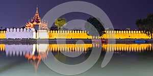 Panorama od the Royal palace illuminated at night in Mandalay Burma Myanmar