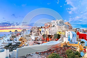 Panorama of Oia or Ia at sunset, Santorini, Greece