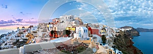 Panorama of Oia or Ia at sunset, Santorini, Greece