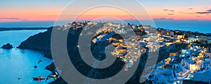 Panorama of Oia or Ia at sunset, Santorini, Greece