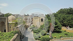 Panorama of the old city in Baku. Stone-paved streets, unrecognisable tourists