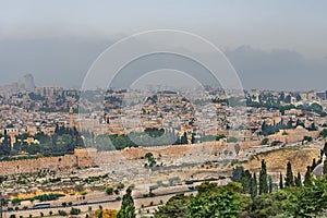 Panorama of the old city Jerusalem and monumental defensive walls. World holy places in Israel