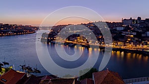 Panorama of old city Porto at river Duoro after sunset day to night timelapse, Oporto, Portugal