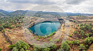 Panorama of old copper mining area with lake and mine tailings