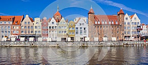 Panorama of old houses and city gate at the Motlawa river in Gdansk