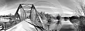 Panorama of an old iron bridge in black and white