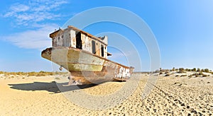 Panorama. Old ship in the Aral desert, rear view