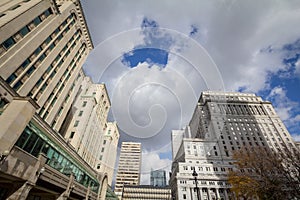 Panorama of old stone skyscrapers and high rise office towers in Montreal dowtown, on Place Victoria Square