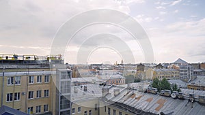 Panorama of old town with gray roofs in cloudy weather. Action. Historical and unremarkable center of city with old photo