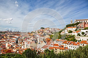 Panorama of the old town in Lisbon at sunny spring day, Portugal. On the hill `Igreja e Convento da Graca` Church