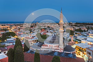 Panorama of the Old Town and the Mosque of Suleyman evening with the moon. Rhodes Island. Greece