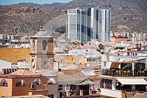 Panorama of old town and Santiago Apostol Malaga church, Spain photo