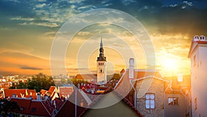 Panorama of old town of Tallinn, Etonia. Tallinn city wall and a view of the Church of St. Olaf. The skyline of the old town, suns