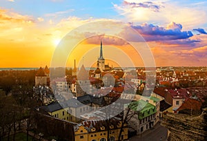 Panorama of old town of Tallinn, Etonia. Tallinn city wall and a view of the Church of St. Olaf. The skyline of the old town, suns