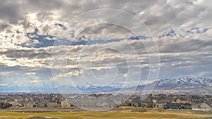 Panorama Panoramic view of cloud filled blue sky over houses on a vast valley