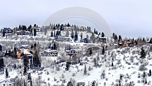 Panorama Park City Utah neighborhood in winter with colorful homes on snowy hill top