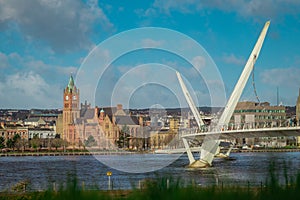 Panorama of peace bridge in Derry or Londonderry spanning across