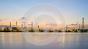 Panorama petrol refinery river front with sunrise sky background