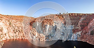 Panorama of PeÃ±a del Hierro open mine pit. Deep excavation of pyrite and extraction of minerals of copper and gold in