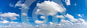 Panorama photo of blue sky background with many floating white clouds