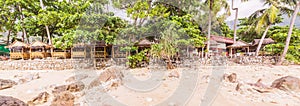 Panorama picture of straw bamboo cottages food shop at Kalim beach side, Phuket, Thailand