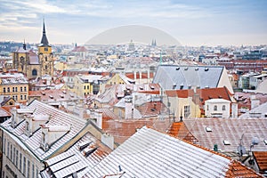 Panorama of Prague roofs covered with snow in winter, Czech Republic