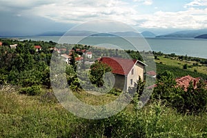 Panorama of Prespa lake, in the southern of the Republic of Northern Macedonia, in an early spring morning, with mountains