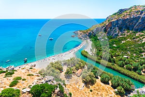 Panorama of Preveli beach at Libyan sea, river and palm forest, southern Crete.