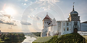 Panorama promenade overlooking the old city and historic buildings of medieval castle near bridge and wide river